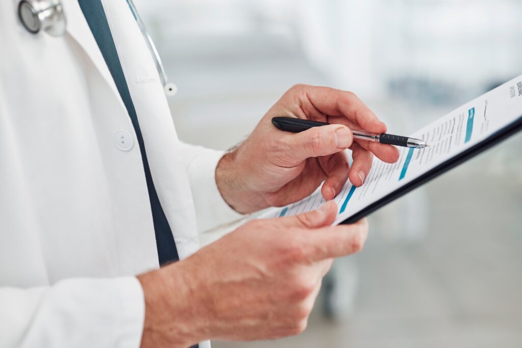 Doctor, reading or hands writing checklist for healthcare consulting, medical information or insura